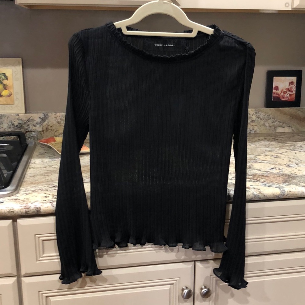 Sheer black ruffle edged top